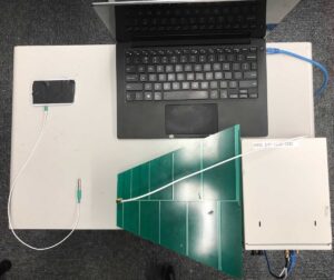 The setup used to test the effect of radio interference on temperature sensors. Clockwise from upper left: a real-time temperature logger, laptop, radio interference generator, antenna and temperature probe. Image credit: Yan Long