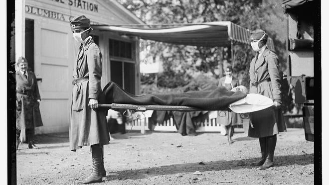 This Library of Congress photo shows a demonstration at the Red Cross Emergency Ambulance Station in Washington, D.C., during the influenza pandemic of 1918. Science has ticked off some major accomplishments over the last century. The world learned about viruses, cured various diseases, made effective vaccines, developed instant communications and created elaborate public-health networks. Yet in many ways, 2020 is looking like 1918, the year the great influenza pandemic raged. (Library of Congress Prints and Photographs Division via AP)