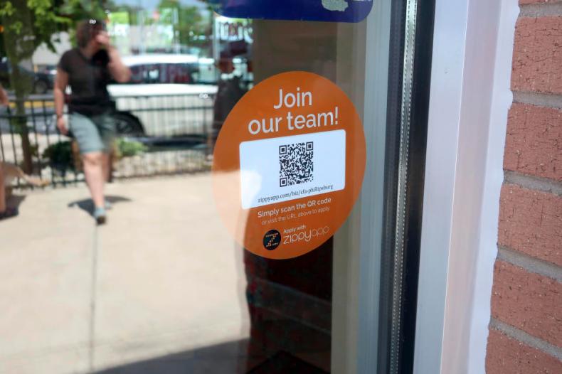 In this May 25, 2018, photo, a decal with a QR code at the entrance to a Chick-fil-A in Phillipsburg, N.J.,invites people to apply for work at the restaurant. On Tuesday, June 5, the Labor Department reports on job openings and labor turnover for April. (AP Photo/Ted Shaffrey)