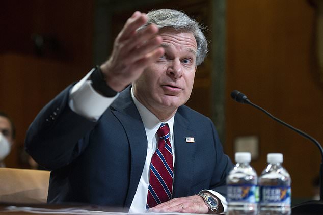 FILE - FBI director Christopher Wray testifies during a Senate Appropriations Subcommittee hearing in Washington, on May 25, 2022. Wray says his agents thwarted a planned cyberattack on a Boston children's hospital that was to have been carried out by hackers sponsored by the Iranian government. (Bonnie Cash/Pool Photo via AP, File)